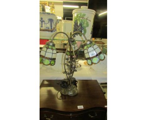 A three light table lamp with Tiffany style shades. (collect only)