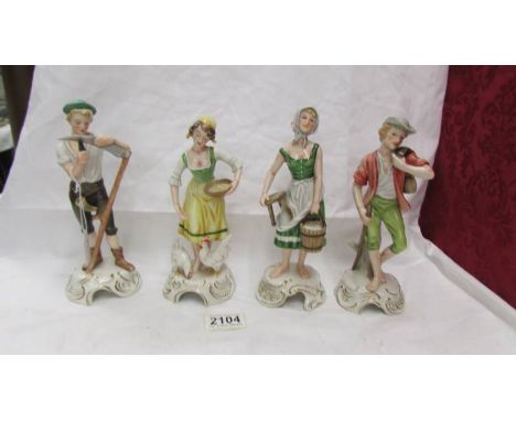 A set of four Goebel figurines.