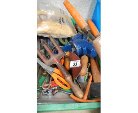 A green tray of tools.