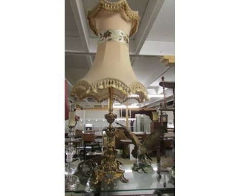 A good quality heavy brass table lamp with good quality fringed shade. (Collect only)