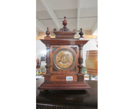 An 8 day striking mantel clock.