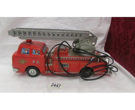 A Japanese tin plate fire engine by Modern Toys, Made in Japan.