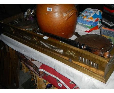 An old brass fire fender and 2 part warming pans. (collect only)