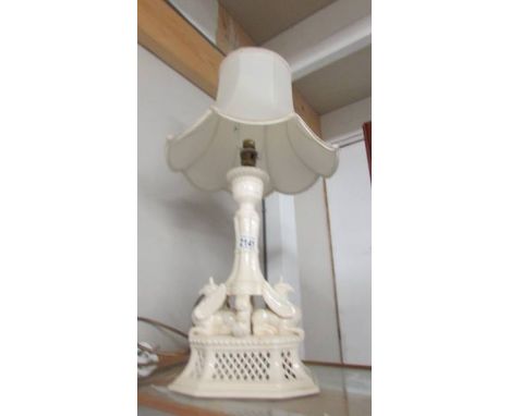 A Royal Creamware 'Gryphin' table lamp with shade. ****Condition report**** Crack at top approximately 3 - 4cm long running d