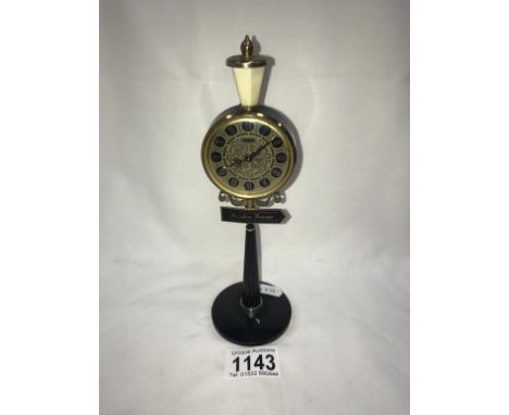 A vintage Rhythm alarm clock in form of a Moulin Rouge street lamp