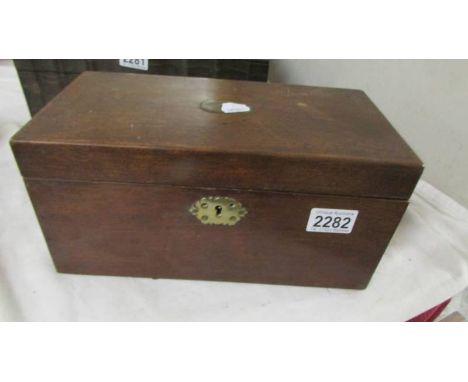 A Victorian mahogany tea caddy.