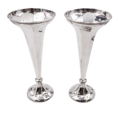 Pair of early 20th century silver trumpet vases, of tapering faceted form, upon spreading filled bases, hallmarked Thomas Edw