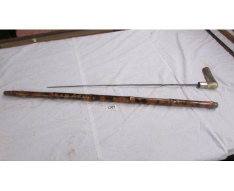 An old bamboo sword stick with horn handle, 90 cm, blade 63 cm.