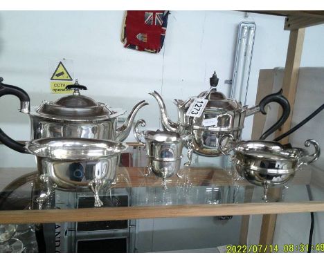A three piece silver plate tea set, a silver plater teapot and a sugar bowl.