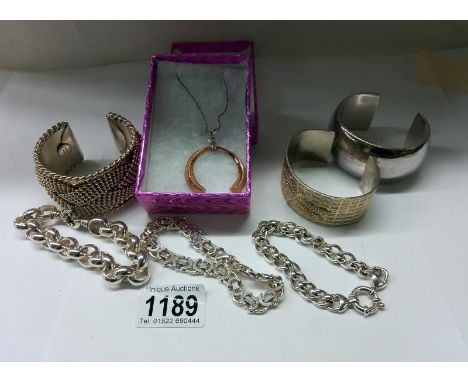 Two heavy silver bangles, a silver chain bracelet, a pendant on silver chain, 2 white metal bracelets and a white metal bangl