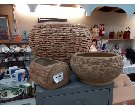 A large wicker round planter and 2 others