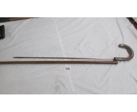An old sword stick, 90 cm, blade 68 cm.Silver collar on the stick join is split and loose on the stick.