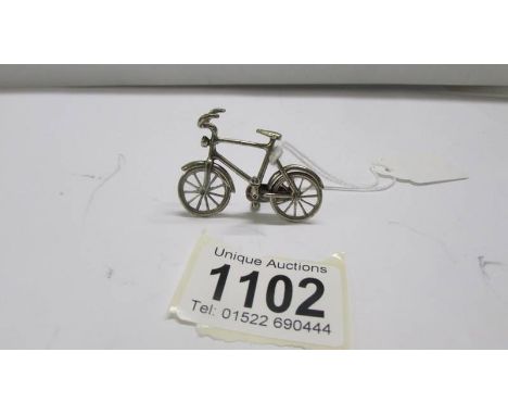A small silver bicycle.