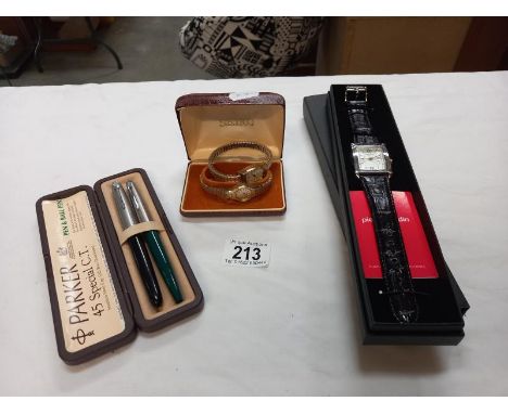 A Seiko ladies wrist watch, a Timex ladies wristwatch, a Pierre Cardin gents wrist watch and a Parker pen set