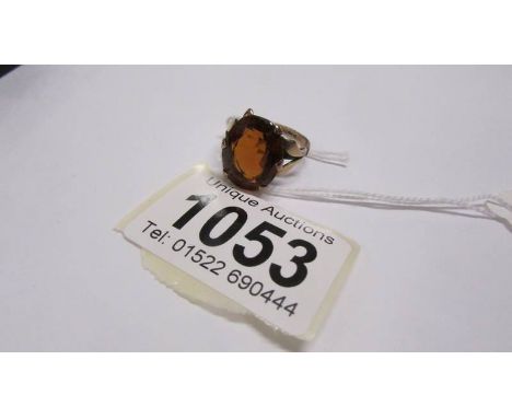 A gold ring set garnet, size O. 5 grams total.