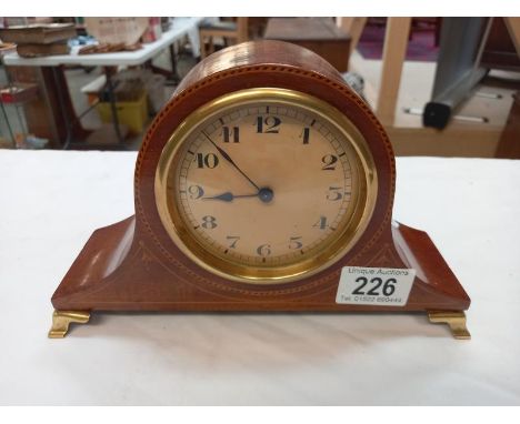 An inlaid mantle clock