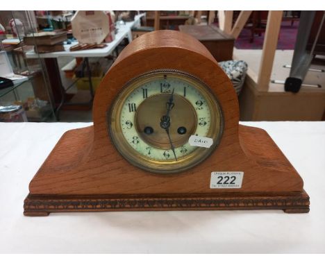 An oak mantle clock