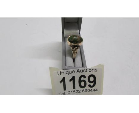 An antique ring, Chester, dated 1909 set with a turquoise in 9ct gold with fancy openwork shoulders.&nbsp; Size R.