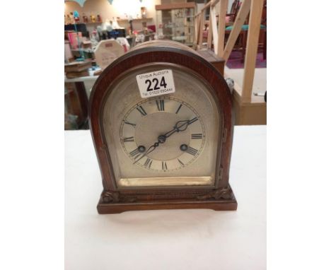 A bracket mantle clock with silvered dial, dedicated and dated 1929. Height 23cm