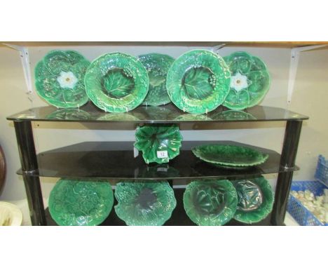 Ten green ceramic plates.