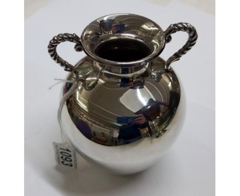 A silver vase, 17 cm tall.