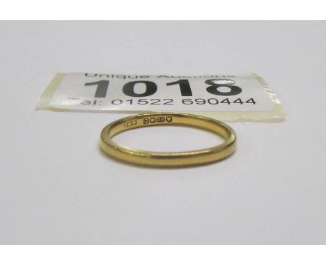 A 22 carat gold wedding ring, size J, 2 grams.