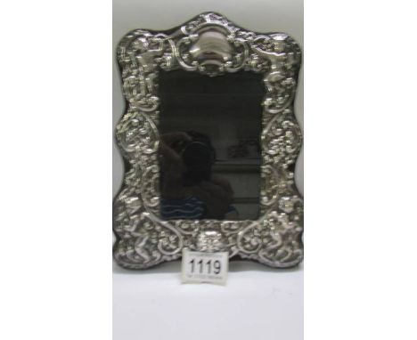 A silver photo frame, 25 x 19 cm.