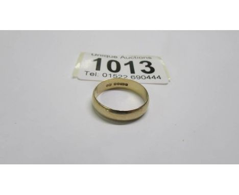 A 9ct gold wedding ring, size N. 2.3 grams.