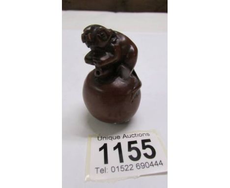 A chinese mouse in apple netsuke.