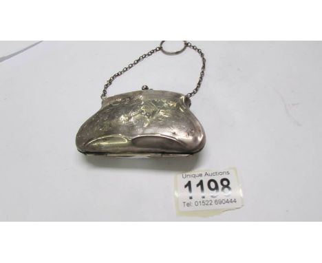 A Victorian silver purse. (some dents).