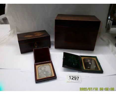 A mahogany tea caddy, a mahogany card box and two travelling photo frames.