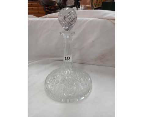 A Regency-style cut-glass ships decanter and four wine glasses