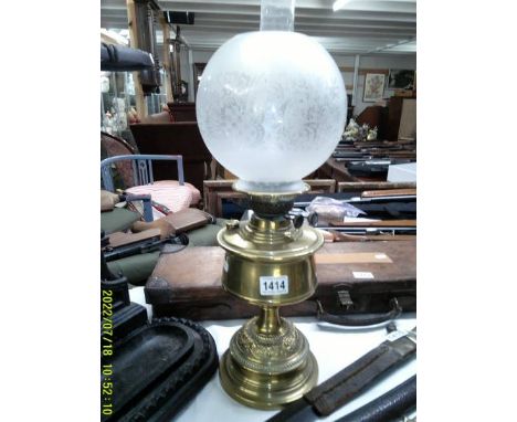 A brass oil lamp with etched glass shade. COLLECT ONLY.