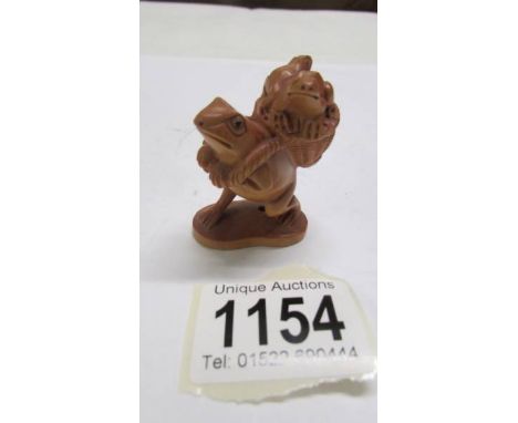 A Chinese boxwood netsuke.