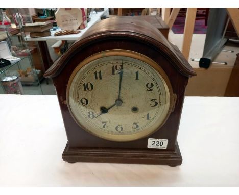 A mantle clock with silvered dial
