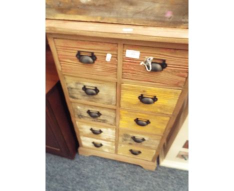 A shabby chic bank of ten short drawers