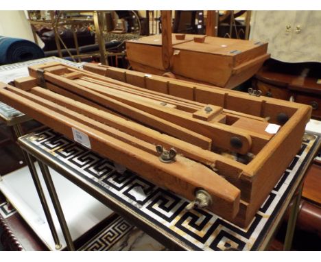A vintage travelling adjustable easel