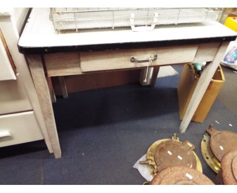 A vintage painted kitchen table with enamel top and frieze drawer