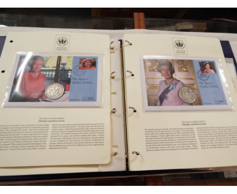 An album of mint coin first day covers and stamps depicting the Queen's Golden Jubilee 2002, some limited edition