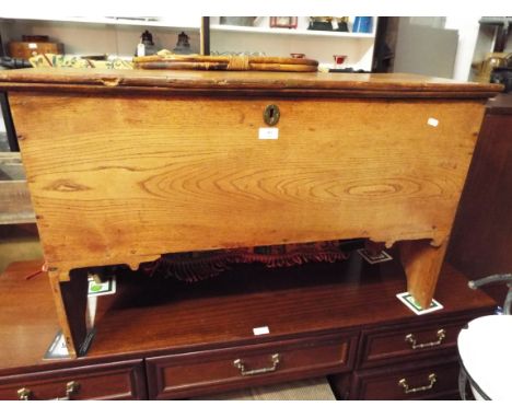 A late Victorian light oak coffer on V shaped supports 