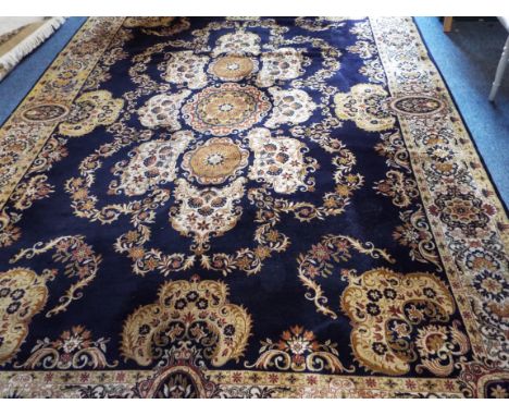 A blue ground Persian carpet 346cm x 250cm