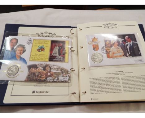 An album of mint coin first day covers and stamps depicting the Queen's Golden Jubilee 2002, some limited edition