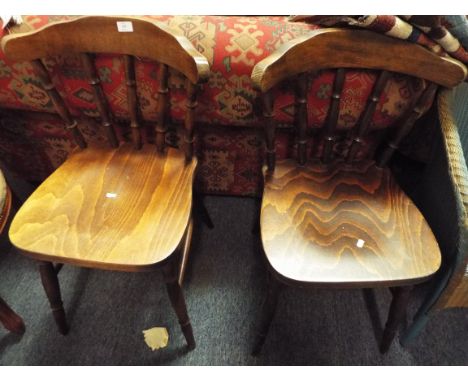 A pair of stick back chairs