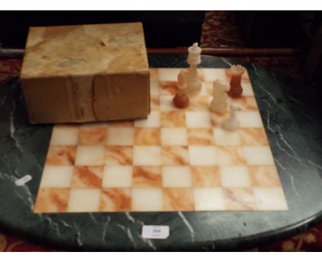 A hand made marble chess set and board 