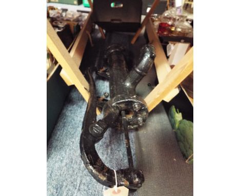 A vintage cast metal water pump
