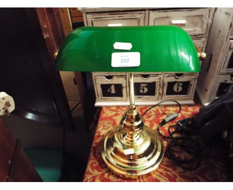 A bankers desk lamp with glass shade