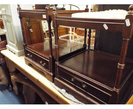 A pair of mahogany square section two-tier side tables each fitted with single base drawers