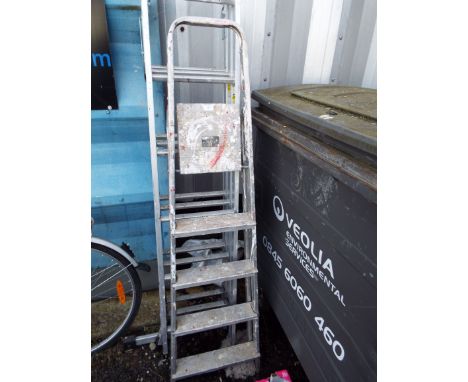 An aluminium three-section ladder together with an aluminium step ladder