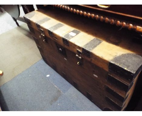 A stained pine and metal bound sea trunk