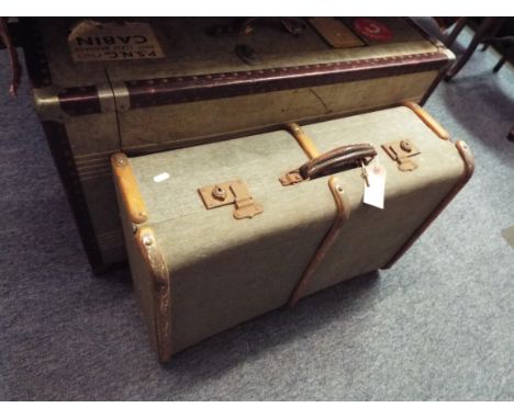 A Cunard White Line travelling trunk and a wooden bound steamer trunk
